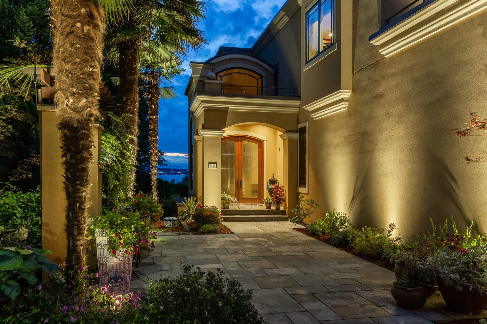 Medina home with architectural and landscape lighting around front entry